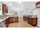Modern kitchen featuring stainless steel appliances, granite countertops, and hardwood floors, offering functionality and style at 1810 Laura Creek Rd, Charleston, SC 29412