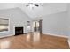 Spacious living room featuring hardwood floors, a cozy fireplace, and sliding glass doors leading to an outdoor space at 1810 Laura Creek Rd, Charleston, SC 29412