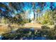 Waterfront backyard featuring a serene pond and lush foliage at 1810 Laura Creek Rd, Charleston, SC 29412