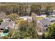 An aerial view of a single Gathering home surrounded by mature trees and neighboring houses at 1874 Rifle Range Rd, Mount Pleasant, SC 29464