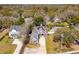 A beautiful aerial view of a house with a driveway and landscaping, nestled in a lush neighborhood with mature trees at 1874 Rifle Range Rd, Mount Pleasant, SC 29464