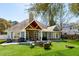 Spacious backyard features an outdoor kitchen, a fire pit and seating area, perfect for entertaining at 1874 Rifle Range Rd, Mount Pleasant, SC 29464