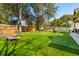 Large backyard with artificial turf, corn hole, outdoor seating area and a swing at 1874 Rifle Range Rd, Mount Pleasant, SC 29464