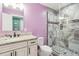 Modern bathroom with marble walk-in shower and single vanity at 1874 Rifle Range Rd, Mount Pleasant, SC 29464