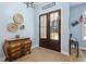 Inviting entryway with decorative baskets, charming chest and wood-look tile flooring at 1874 Rifle Range Rd, Mount Pleasant, SC 29464