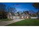 Charming two-story home with stone accents, a three-car garage, and well-maintained landscaping at 1874 Rifle Range Rd, Mount Pleasant, SC 29464