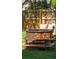 Backyard with outdoor fire pit sitting area with a brick base and built in seating at 1874 Rifle Range Rd, Mount Pleasant, SC 29464