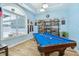 Bright game room featuring a pool table, and a large window overlooking the neighborhood at 1874 Rifle Range Rd, Mount Pleasant, SC 29464