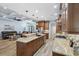 Open kitchen with breakfast bar, granite counters, and view of the living room at 1874 Rifle Range Rd, Mount Pleasant, SC 29464