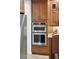 Stainless steel KitchenAid double oven and microwave nestled between wooden cabinets at 1874 Rifle Range Rd, Mount Pleasant, SC 29464