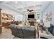 Inviting living room boasting coffered ceilings, stone fireplace and open layout to kitchen and dining at 1874 Rifle Range Rd, Mount Pleasant, SC 29464