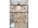 Modern walk-in shower with dual shower heads, bench, and custom tile design at 1874 Rifle Range Rd, Mount Pleasant, SC 29464