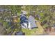 Aerial view of a home with a fenced backyard, screened-in porch and mature trees at 188 Bamert St, Summerville, SC 29483