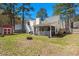 Large backyard with a shed, partial fencing, and a cozy screened-in porch at 188 Bamert St, Summerville, SC 29483