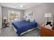 Bedroom with a navy blue quilt, ceiling fan, and dresser at 188 Bamert St, Summerville, SC 29483