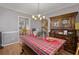 Cozy dining room with vintage hutch and view into the updated kitchen at 188 Bamert St, Summerville, SC 29483