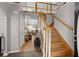 Inviting foyer with hardwood floors, staircase, and views into the spacious living room at 188 Bamert St, Summerville, SC 29483