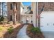 Welcoming front entrance with a charming porch, American flag, and manicured landscaping at 188 Bamert St, Summerville, SC 29483