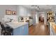 Well-lit kitchen with stainless steel appliances, marble countertops, and an adjacent dining area at 188 Bamert St, Summerville, SC 29483