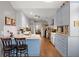 Bright kitchen with blue and white cabinetry, stainless steel appliances, and a breakfast bar at 188 Bamert St, Summerville, SC 29483