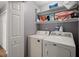 Laundry room with a white washer and dryer and shelving at 188 Bamert St, Summerville, SC 29483