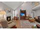 Inviting living room featuring vaulted ceilings, a fireplace, and an entertainment center at 188 Bamert St, Summerville, SC 29483