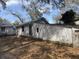 View of the home's exterior and backyard space filled with fallen leaves at 1907 Helm Ave, North Charleston, SC 29405