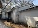Side view of the property showcasing the home's exterior and tin roof at 1907 Helm Ave, North Charleston, SC 29405