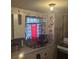 Kitchen area showcasing the sink, cabinets, decorations, and a window at 1907 Helm Ave, North Charleston, SC 29405