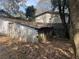 Outdoor shed with a door and window, surrounded by trees and foliage at 1907 Helm Ave, North Charleston, SC 29405