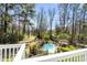 An aerial view of a backyard pool, patio, and landscaping at 1988 Long Creek Rd, Wadmalaw Island, SC 29487