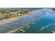Expansive aerial view of multiple docks extending into a scenic waterway with lush greenery at 1988 Long Creek Rd, Wadmalaw Island, SC 29487