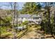 Aerial view of house with a swimming pool, patio, and lush landscaping at 1988 Long Creek Rd, Wadmalaw Island, SC 29487