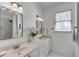 Bathroom featuring double sinks, marble floors, and shower at 1988 Long Creek Rd, Wadmalaw Island, SC 29487