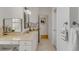 Bathroom featuring marble floors, granite vanity, and makeup area at 1988 Long Creek Rd, Wadmalaw Island, SC 29487