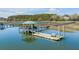 Beautiful dock with a covered area and bench, providing a tranquil spot to enjoy waterfront views at 1988 Long Creek Rd, Wadmalaw Island, SC 29487