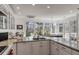 Gourmet kitchen featuring granite countertops, custom cabinetry, and stainless steel appliances at 1988 Long Creek Rd, Wadmalaw Island, SC 29487