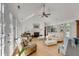 Spacious living room with fireplace, natural light and hardwood floors at 1988 Long Creek Rd, Wadmalaw Island, SC 29487