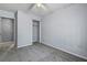 Cozy bedroom with gray carpet, ceiling fan, closet, and neutral paint at 201 Commons Way, Goose Creek, SC 29445