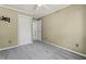 Bedroom with gray carpet, ceiling fan, neutral paint, and a closet at 201 Commons Way, Goose Creek, SC 29445