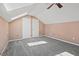 Cozy bedroom featuring neutral walls, gray carpet, and two closets with white doors at 201 Commons Way, Goose Creek, SC 29445