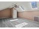 Bright bedroom with skylights, ceiling fan, and gray carpet at 201 Commons Way, Goose Creek, SC 29445