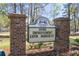 Crowfield Plantation signage for Home Improvement Expo, featuring brick pillars and floral arrangements at 201 Commons Way, Goose Creek, SC 29445