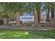 Welcoming entrance to Planter's Walk with brick pillars and neatly manicured landscaping at 201 Commons Way, Goose Creek, SC 29445