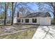 Charming single-story home featuring a garage and a well-maintained front yard and driveway at 201 Commons Way, Goose Creek, SC 29445