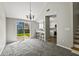 Bright and airy living space flows into the kitchen with a sliding door providing natural light at 201 Commons Way, Goose Creek, SC 29445