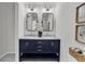 Bathroom features a double vanity with marble countertop and modern fixtures at 202 Basswood Ave, Summerville, SC 29483
