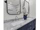 Bathroom featuring marble countertop, double sinks, and modern fixtures at 202 Basswood Ave, Summerville, SC 29483