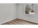 Simple bedroom featuring hardwood floors, a window letting in natural light, and neutral-toned walls at 202 Basswood Ave, Summerville, SC 29483