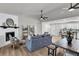 Bright living room features a fireplace, ladder shelves, and an open floor plan at 202 Basswood Ave, Summerville, SC 29483